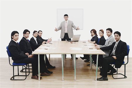 Portrait of a businessman showing thumbs up in a conference room Stock Photo - Premium Royalty-Free, Code: 630-01076240