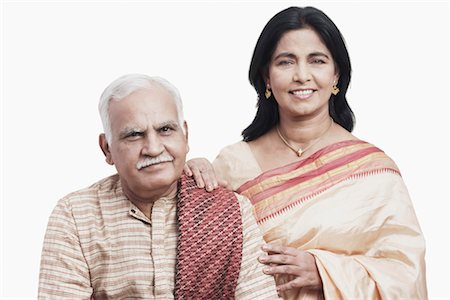 retired indian couple - Portrait of a mature couple smiling Stock Photo - Premium Royalty-Free, Code: 630-01076404