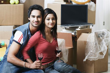 Portrait of a young couple holding wineglasses Stock Photo - Premium Royalty-Free, Code: 630-01076478