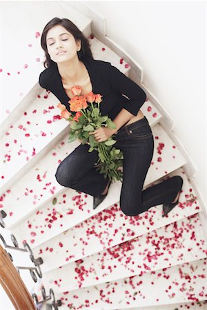 passion for shoes - High angle view of a young woman holding a bouquet of flowers Stock Photo - Premium Royalty-Free, Code: 630-01076517