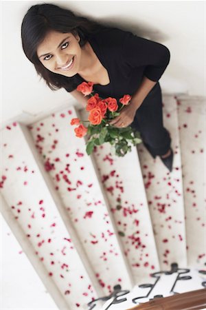 simsearch:630-01130027,k - High angle view of a young woman holding a bouquet of flowers Stock Photo - Premium Royalty-Free, Code: 630-01076513