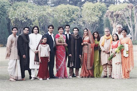 Family standing in the garden Stock Photo - Premium Royalty-Free, Code: 630-01076993