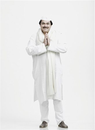 politician kurta and cap - Portrait of a mature man in a prayer position Stock Photo - Premium Royalty-Free, Code: 630-01077091