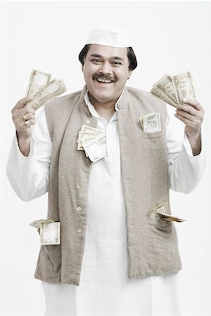 Portrait of a mature man holding Indian currency Foto de stock - Sin royalties Premium, Código: 630-01077104