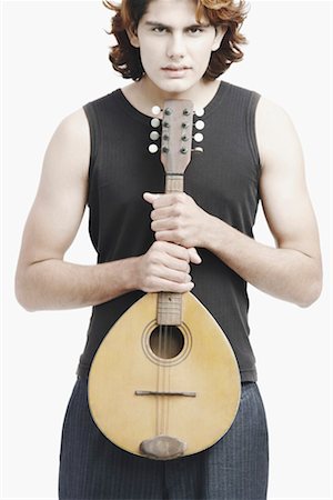 Portrait of a male musician playing the banjo Foto de stock - Sin royalties Premium, Código: 630-01077140