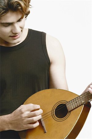 Close-up of a male musician playing the banjo Foto de stock - Sin royalties Premium, Código: 630-01077142