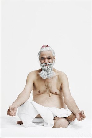 Portrait of a priest sitting in the lotus position Stock Photo - Premium Royalty-Free, Code: 630-01077208