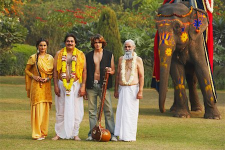 elephant indian costume - Portrait of four people standing together in the park Stock Photo - Premium Royalty-Free, Code: 630-01077278