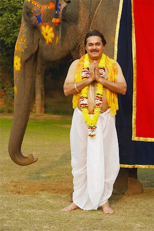 elephant indian costume - Portrait of a priest greeting Stock Photo - Premium Royalty-Free, Code: 630-01077287