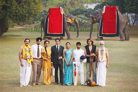 elephant standing on person - Group of people standing in the garden Stock Photo - Premium Royalty-Free, Code: 630-01077300