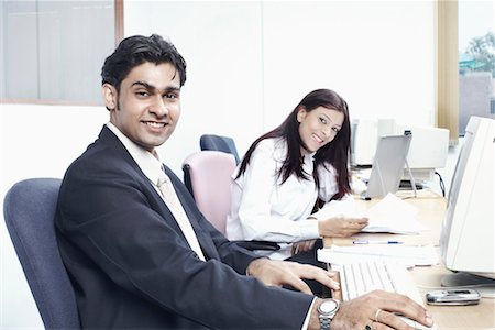 formal mouse computer - Portrait of a businessman and a businesswoman sitting in an office Stock Photo - Premium Royalty-Free, Code: 630-01077450