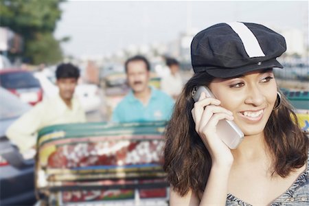 simsearch:630-01078755,k - Close-up of a young woman talking on a mobile phone Fotografie stock - Premium Royalty-Free, Codice: 630-01077731