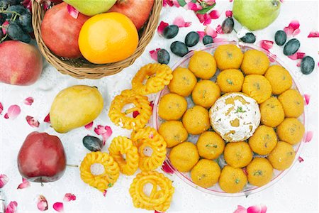 Close-up of a dish of Indian sweets and fruits Stock Photo - Premium Royalty-Free, Code: 630-01077976