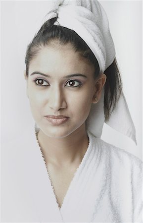 Close-up of a young woman wearing a bathrobe Stock Photo - Premium Royalty-Free, Code: 630-01078167
