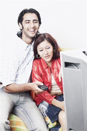 simsearch:6108-06166991,k - Young couple watching television Stock Photo - Premium Royalty-Free, Code: 630-01078424