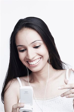 Close-up of a teenage girl holding a mobile phone Stock Photo - Premium Royalty-Free, Code: 630-01078967