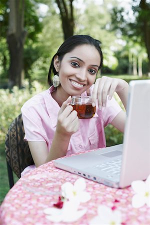 Portrait of a teenage girl holding a cup of tea Stock Photo - Premium Royalty-Free, Code: 630-01079045