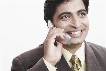 simsearch:630-01078367,k - Close-up of a businessman talking on a mobile phone Foto de stock - Sin royalties Premium, Código: 630-01079421