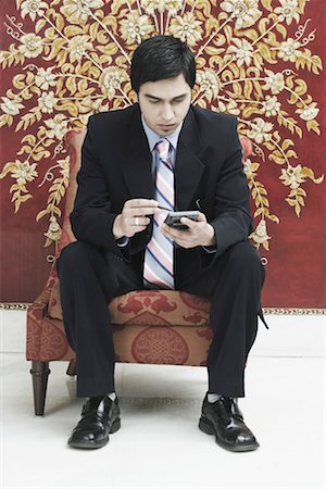 simsearch:630-01076238,k - Businessman using a mobile phone Stock Photo - Premium Royalty-Free, Code: 630-01079657