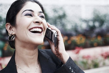 simsearch:630-01079908,k - Close-up of a young woman talking on a mobile phone Stock Photo - Premium Royalty-Free, Code: 630-01079800