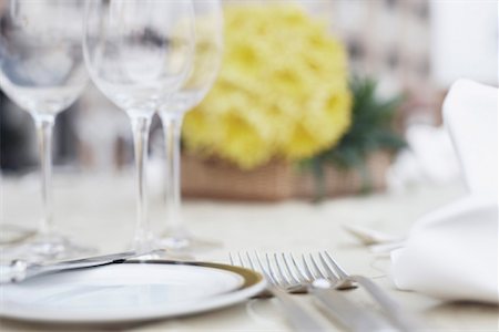 dining table flower arrangement pictures - Close-up of cutlery and crockery on the dining table Stock Photo - Premium Royalty-Free, Code: 630-01080059