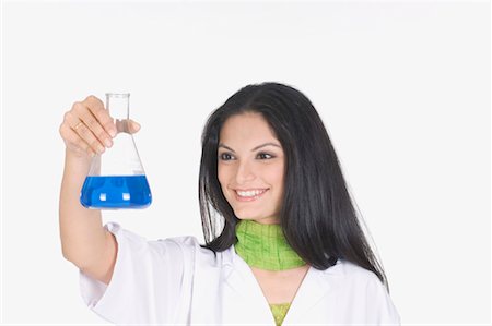 Close-up of a female technician holding a conical flask Stock Photo - Premium Royalty-Free, Code: 630-01080083