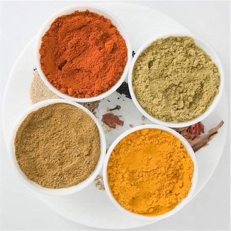 High angle view of spices in four bowls Stock Photo - Premium Royalty-Free, Code: 630-01126696