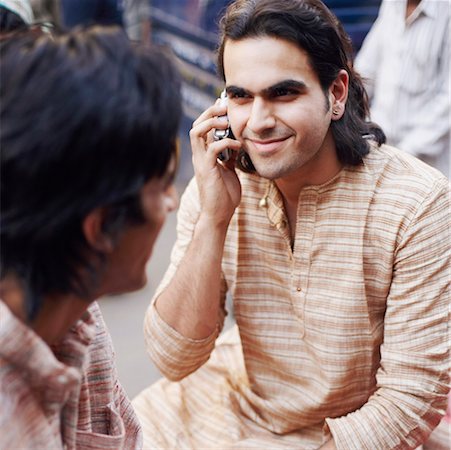 simsearch:630-01128257,k - High angle view of a young man talking on a mobile phone Stock Photo - Premium Royalty-Free, Code: 630-01126849