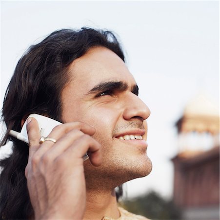 simsearch:630-01128257,k - Close-up of a young man talking on a mobile phone Stock Photo - Premium Royalty-Free, Code: 630-01126921