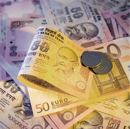simsearch:630-01131137,k - High angle view of Indian banknotes and coins with a fifty Euro banknote Foto de stock - Sin royalties Premium, Código: 630-01126968