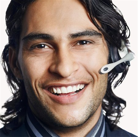 simsearch:630-01128784,k - Portrait of a male customer service representative smiling Stock Photo - Premium Royalty-Free, Code: 630-01126963