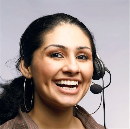 simsearch:630-01130741,k - Close-up of a female customer service representative wearing a headset Stock Photo - Premium Royalty-Free, Code: 630-01126989