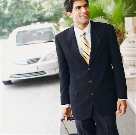 simsearch:630-01128784,k - Close-up of a businessman walking with a suitcase Stock Photo - Premium Royalty-Free, Code: 630-01126983
