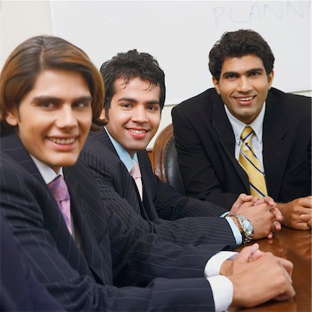 simsearch:630-01126991,k - Portrait of three businessmen smiling Stock Photo - Premium Royalty-Free, Code: 630-01126991