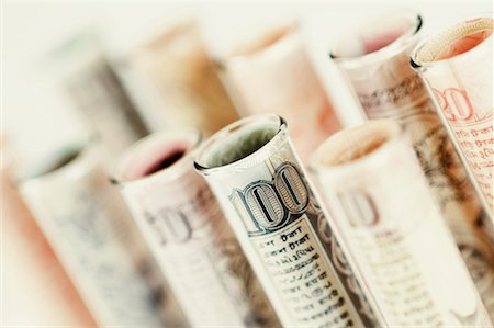 rolled money - Close-up of test tubes wrapped with Indian banknotes of different denominations Stock Photo - Premium Royalty-Free, Code: 630-01127070