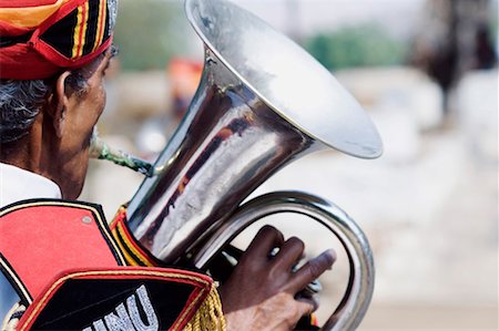 rajasthan music - Rear view of a man playing the tuba, Jaipur, Rajasthan, India Stock Photo - Premium Royalty-Free, Code: 630-01127219