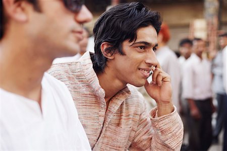 simsearch:630-01128006,k - Close-up of a young man talking on a mobile phone Stock Photo - Premium Royalty-Free, Code: 630-01127511