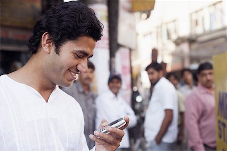 simsearch:630-01128006,k - Close-up of a young man holding a mobile phone Stock Photo - Premium Royalty-Free, Code: 630-01127940