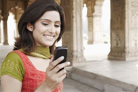 simsearch:630-01128006,k - Close-up of a young woman holding a mobile phone Stock Photo - Premium Royalty-Free, Code: 630-01127961