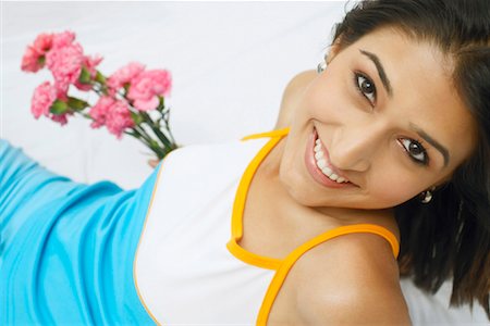 simsearch:630-01130027,k - Portrait of a young woman holding a bunch of flowers and smiling Stock Photo - Premium Royalty-Free, Code: 630-01127979