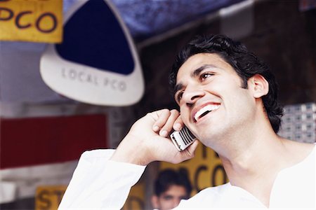 simsearch:630-01128006,k - Close-up of a young man talking on a mobile phone Stock Photo - Premium Royalty-Free, Code: 630-01128020