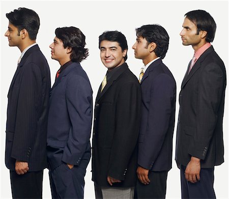 simsearch:630-01078367,k - Portrait of a businessman standing in a row with his colleagues Foto de stock - Sin royalties Premium, Código: 630-01128229