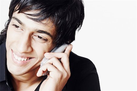 simsearch:630-01128257,k - Close-up of a young man talking on a mobile phone Stock Photo - Premium Royalty-Free, Code: 630-01128249