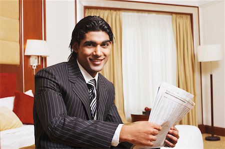 simsearch:630-01130741,k - Portrait of a businessman holding a newspaper Stock Photo - Premium Royalty-Free, Code: 630-01128305