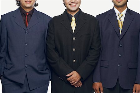 simsearch:630-01126991,k - Close-up of three businessmen standing side by side Stock Photo - Premium Royalty-Free, Code: 630-01128315