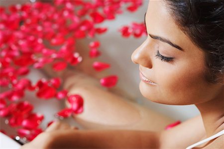 face with rose - Close-up of a young woman in a bathtub Stock Photo - Premium Royalty-Free, Code: 630-01128519