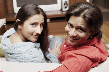 simsearch:630-01130027,k - Portrait of a young couple sitting on a couch Stock Photo - Premium Royalty-Free, Code: 630-01128676