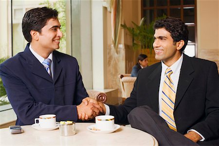 simsearch:630-01128810,k - Close-up of two businessmen sitting in a cafeteria Stock Photo - Premium Royalty-Free, Code: 630-01128672