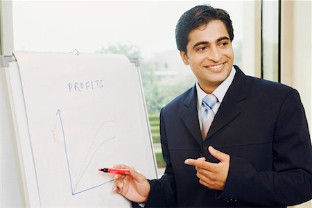 success graph - Close-up of a businessman explaining on a whiteboard Stock Photo - Premium Royalty-Free, Code: 630-01128686