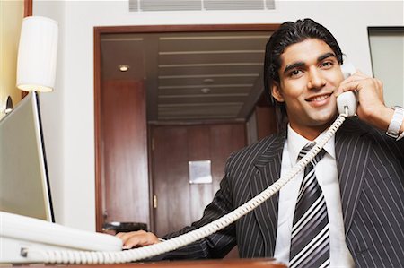 simsearch:630-01128784,k - Portrait of a businessman talking on the telephone Stock Photo - Premium Royalty-Free, Code: 630-01128688
